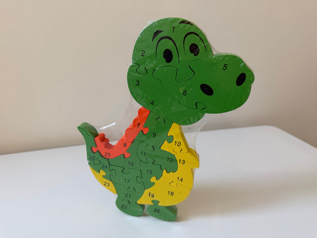 Medinė lavinamoji dėlionė „Dinozauras“ su skaičiais ir raidėmis